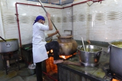 Volunteers preparing meal, Gurdwara Sis Ganj Sahib, Delhi