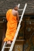 Monk on ladder at Temple of the Tooth