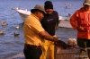 Fisherman cleaning fish, Puerto Magdalena