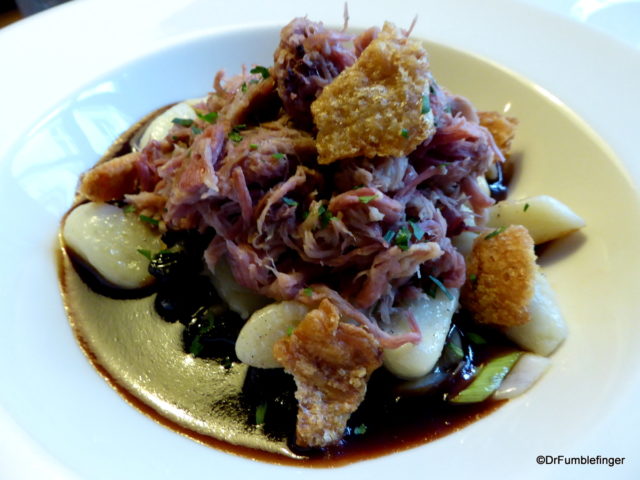 (Cured pig knuckle served with potato dumplings, leeks, prunes, holy grass and apple sauce)